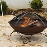 Glow Tuscany 55cm Weathering Steel Fire Pit GLOW2403 being used in a patio setting