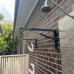 Sky Dry Mini 80 Clothesline mounted on exterior wall — open showing 8 lines across 800mm