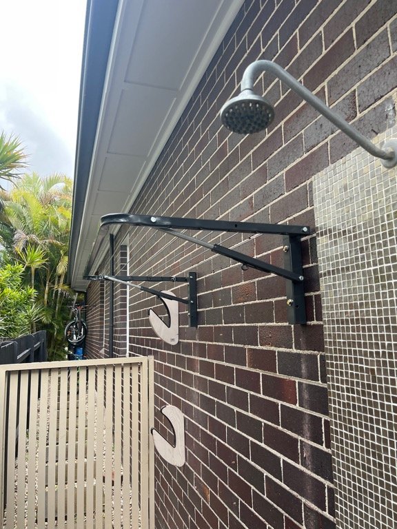 Sky Dry Mini 80 Clothesline mounted on exterior wall — open showing 8 lines across 800mm