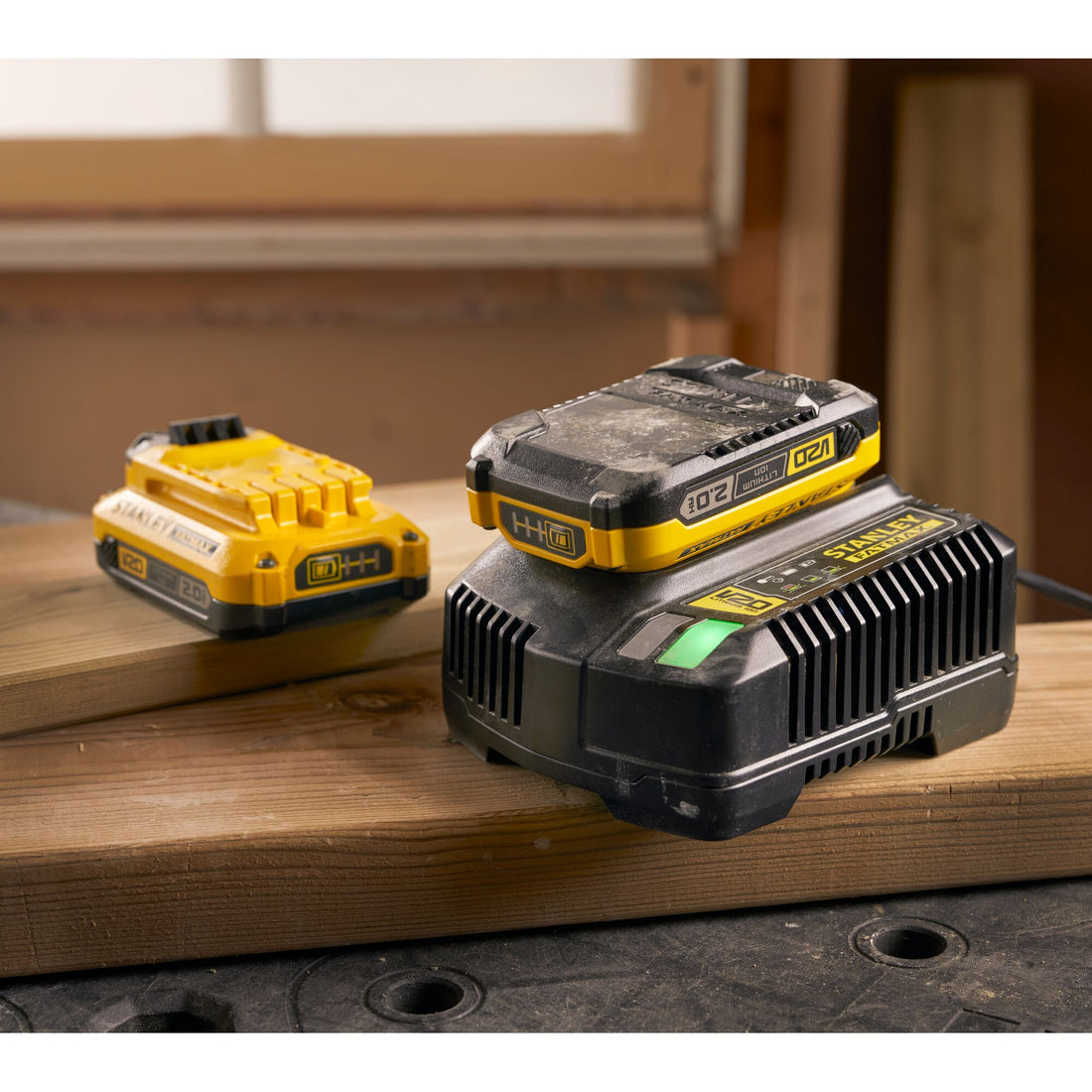 Stanley FatMax V20 2.0Ah battery and charger set on workbench