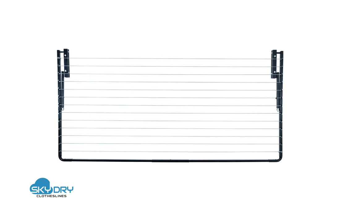 Sky Dry Modern 240 Clothesline — folded flat against wall showing compact footprint