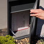 Empire Parcel Letterbox in grey steel with a hand lifting the top lid to reveal a delivered parcel inside