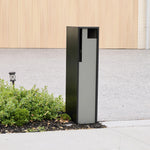 Swift Letterbox in grey installed against a wall, straight-on front view of the recessed mail slot