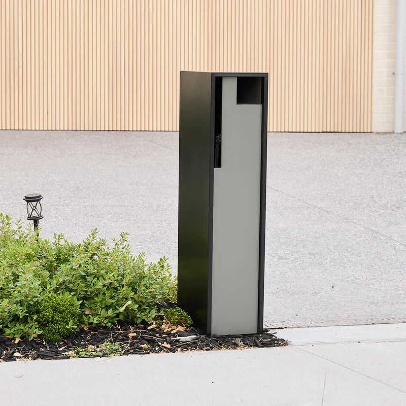 Swift Letterbox in grey installed against a wall, straight-on front view of the recessed mail slot