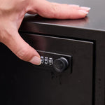 Zephyr Parcel Letterbox in charcoal steel, close up of a hand setting the combination lock dial