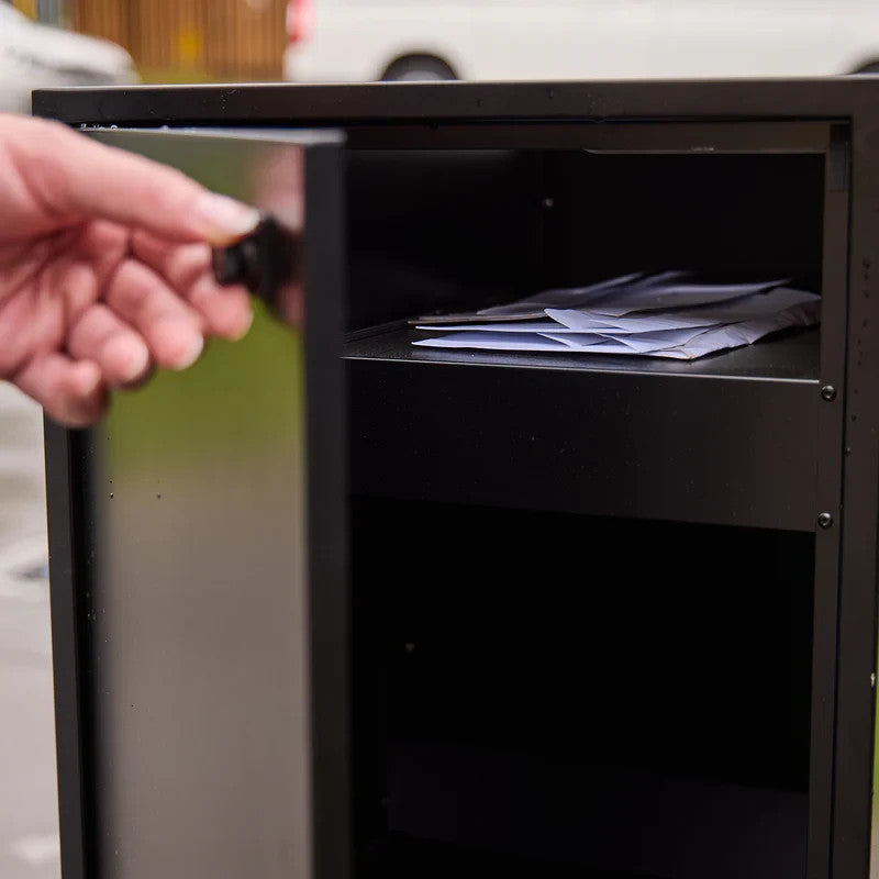 Zephyr Parcel Letterbox in charcoal steel, side door open revealing mail collected on the internal shelf