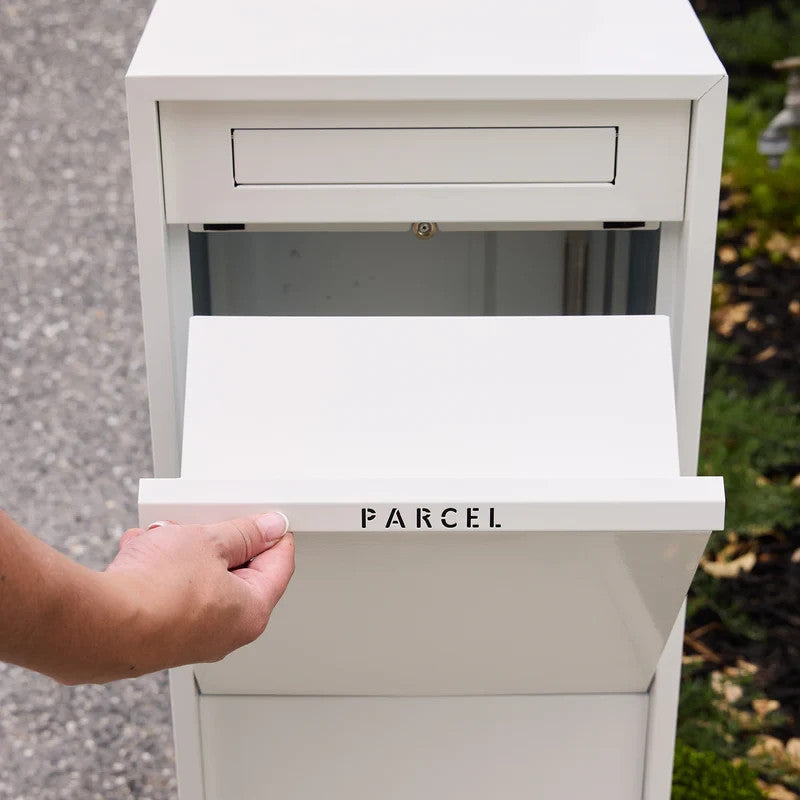 Zip Parcel Letterbox in white, close-up of a hand pulling open the front PARCEL intake drawer.